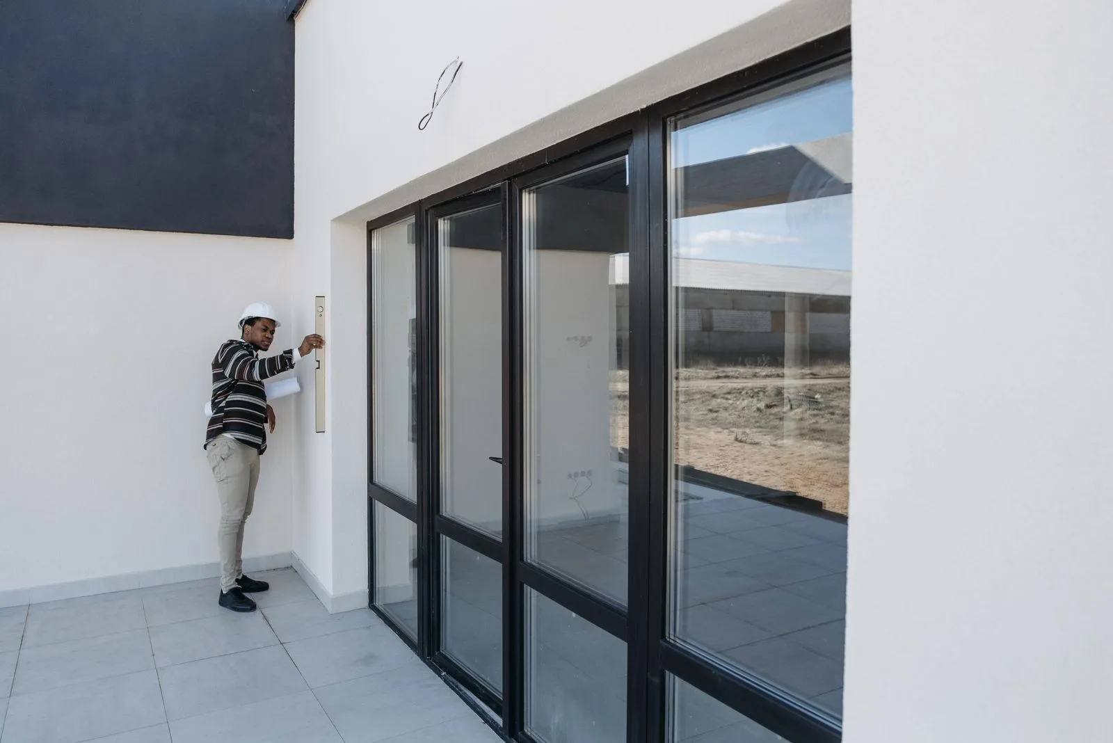 Professional standing inside a property