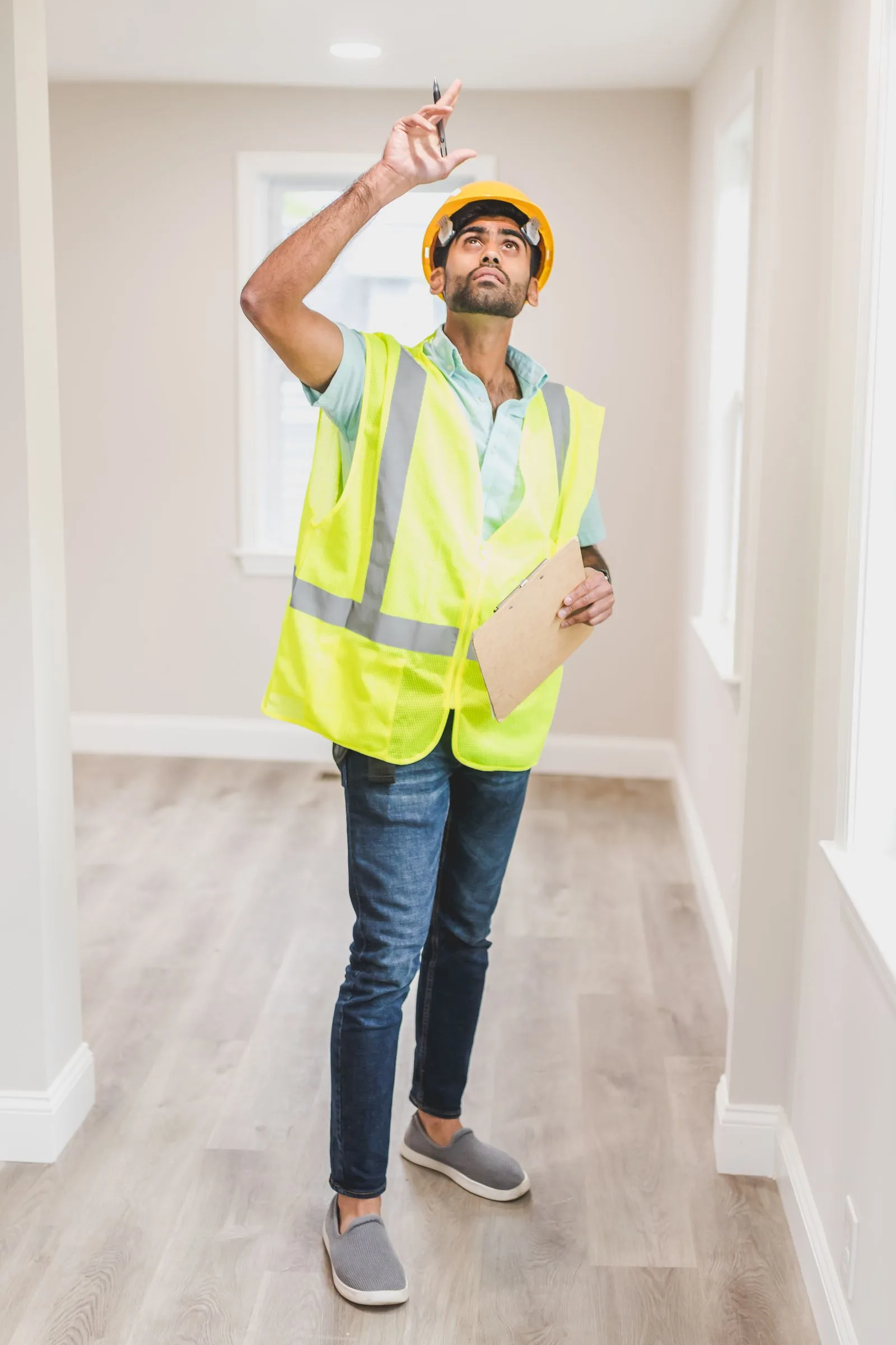 Inspector checking a ceiling