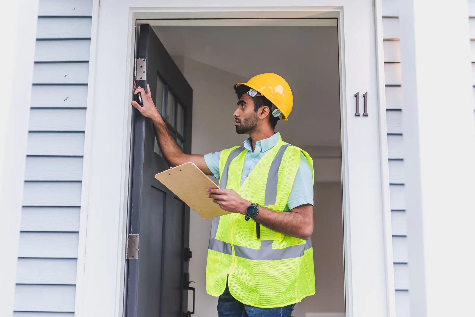 Professional reviewing a residential property