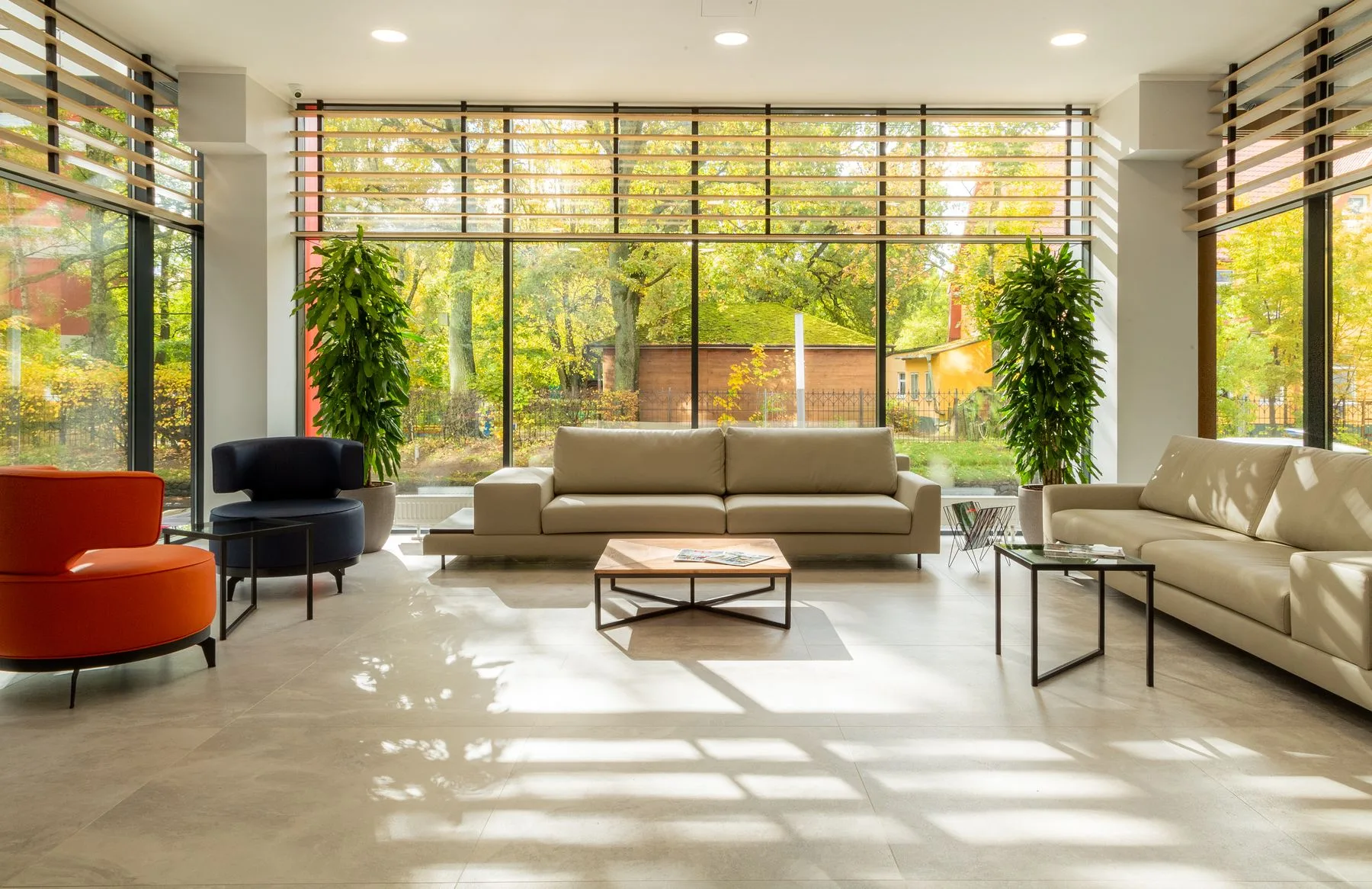 a bright living room overlooking a garden