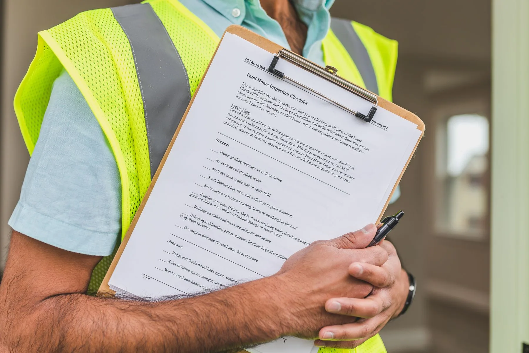 a professional reviewing a property inspection checklist
